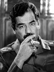 Saddam Hussein smokes cigar